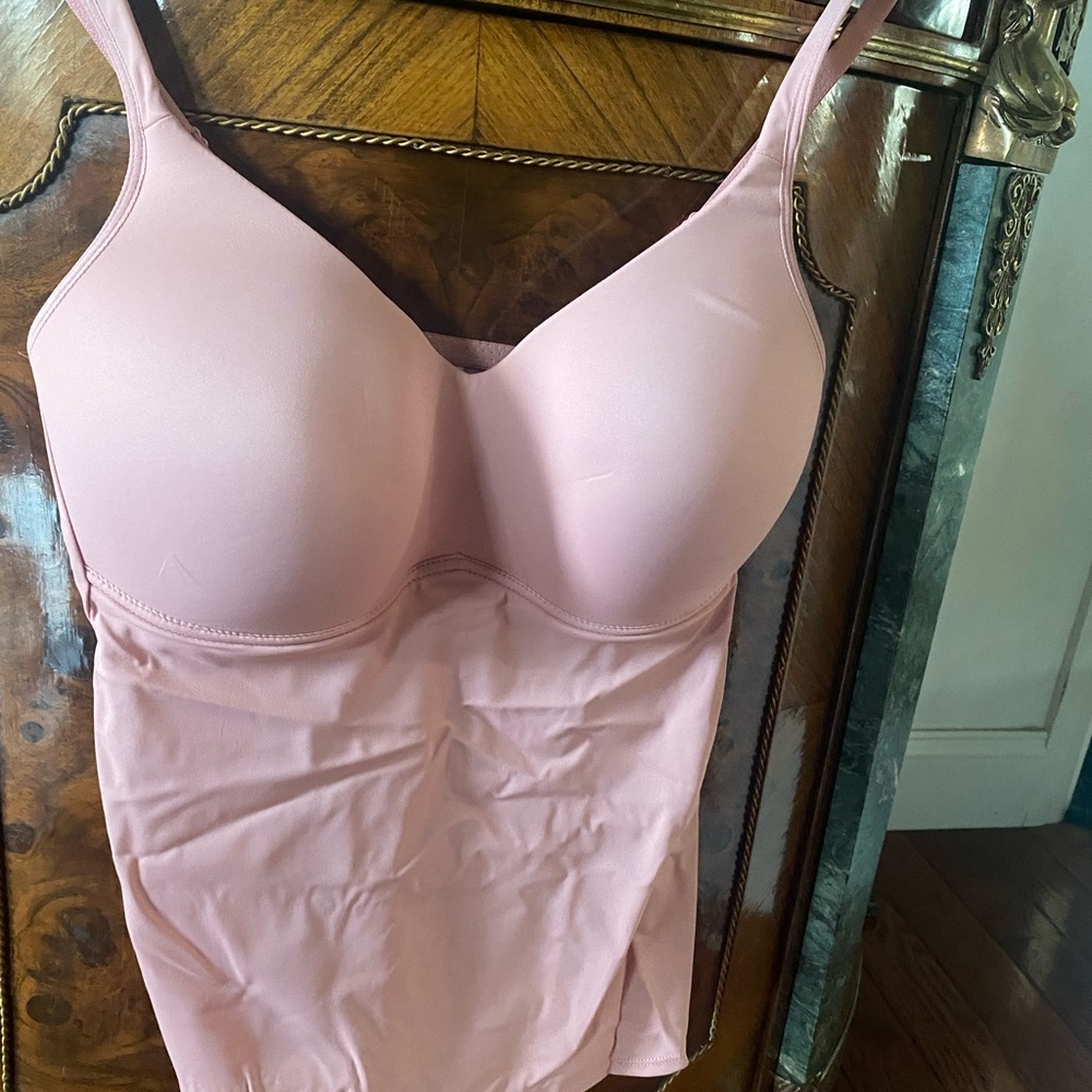 One pink dusty rose color and one beige shelf bra top